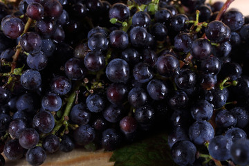 Black wine grape on table