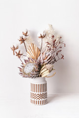Beautiful dried flower arrangement in a stylish ceramic white vase with brown aztec pattern. Dried...