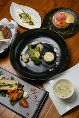 A full-course dinner on the restaurant table. Various meals and desserts served at the restaurant table.
