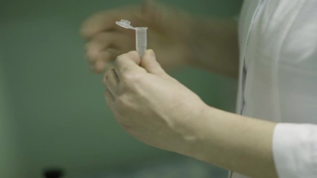 The operator measuring a sample of water or solution in a chemical laboratory in a medical solution factory. close up medical industry