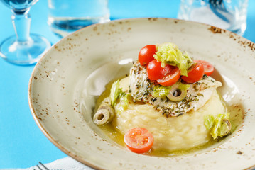 fish and mashed potato with vegetables