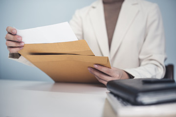 Business woman in suite working with  documentary data on white desk at office, Business accounting and financial concept