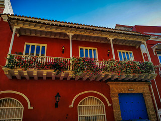 Fototapeta na wymiar CARTAGENA, COLOMBIA - NOVEMBER 09, 2019: Colorful buildings in a street of the old city of Cartagena Cartagena de Indias in Colombia