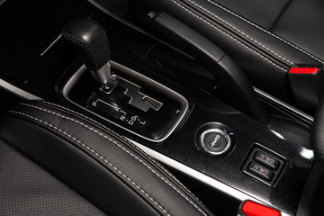 Obraz na płótnie Canvas Gear shift. automatic transmission gear of car and seat heatting buttons , car interior.