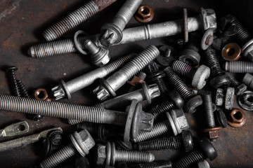 Flat Lay metal fasteners: vinitics, screws, nuts, nails, interchangeable heads, top view. Close-up Carpenter's Tool Kit
