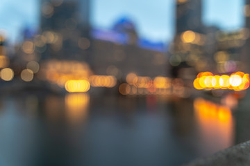 An out of focus skyline background photo of buildings along the Chicago River in downtown at night...