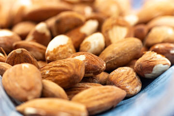 Close up of salted almonds in a bag