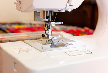 Close up of threaded sewing machine needle