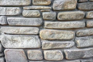 masonry wall paving stones as a background close up