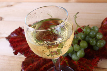 Grape and wine on table