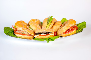 meat burger platter between bread with salad, tomato sauce, ketcup, french fries