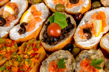 plate with meat, meatballs, vegetables, cheese, mushrooms and bread