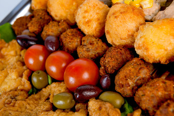 plate with meat, meatballs, vegetables, cheese, spices and bread