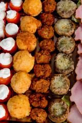 plate with meat, meatballs, vegetables, cheese, spices and bread