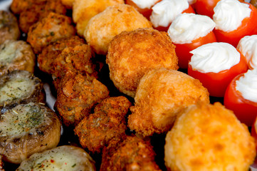 plate with meat, meatballs, vegetables, cheese, spices and bread