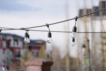 Obraz premium Lights strung out on wire in outside space