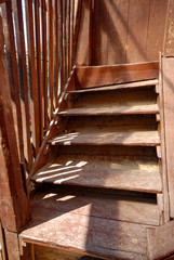 Fototapeta na wymiar wooden stairs of the abandoned house