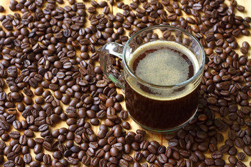 Black coffee with background coffee beans. copy space for text and design