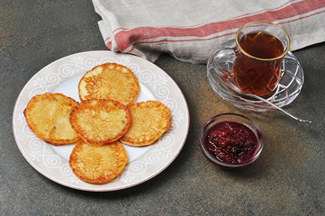 tea with homemade pancakes and jam