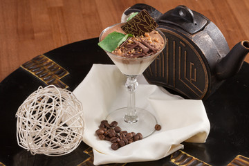 Chocolate mousse with mint in portion glasses