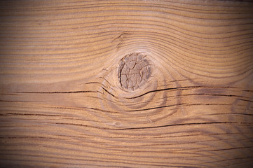 Textured wooden board with dimming in the corners.