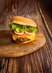 homemade hamburger on a wooden board. 