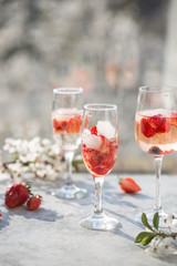 Sangria. Pink cocktail with champagne or prosecco and fresh raspberries for St. Valentine's day.