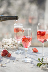 Sangria. Pink cocktail with champagne or prosecco and fresh raspberries for St. Valentine's day.