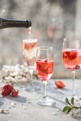 Sangria. Pink cocktail with champagne or prosecco and fresh raspberries for St. Valentine's day.