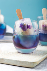 Color food. Cool herbal summer drink, Butterfly pea and lemongrass juice added. A beautiful color and tasty beverage cocktail.