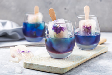Color food. Cool herbal summer drink, Butterfly pea and lemongrass juice added. A beautiful color and tasty beverage cocktail.