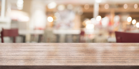 3D Rendering, Wooden top table with bokeh light effect and blur restaurant on background, blur background