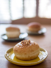 Close up doughnuts on ceramic plates. Concept for cafe vibe.(selective focus)