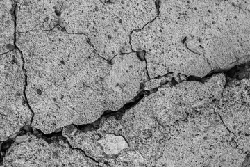Abstract cement background. Cracked old concrete texture closeup.
