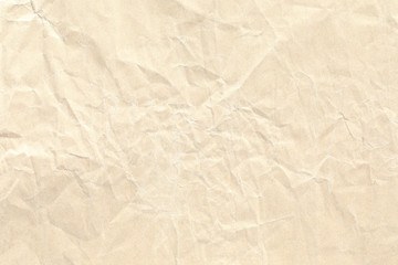 Old pale yellow crumpled paper background texture