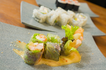 delicious assorted Japanese sushi rolls on beautiful set up on table in traditional healthy Asian food and creative oriental dining - Japan gourmet cuisine tasting menu