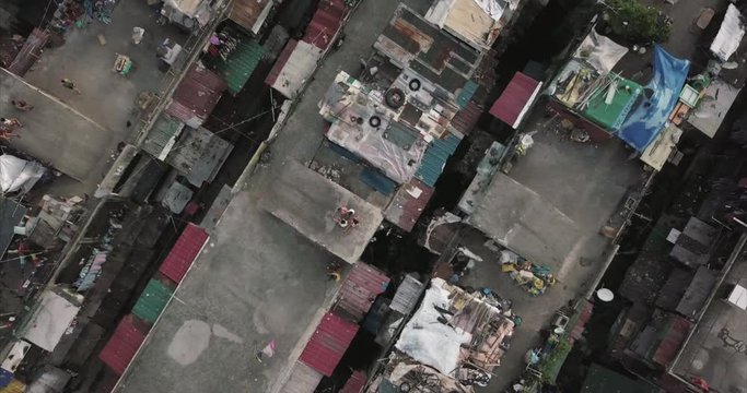  Ascending aerial flight, bird's eye view over poor housing, Tondo, Manila, Philippines