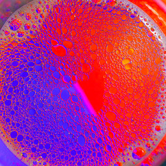 water and oil on a multicolored background