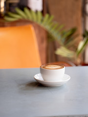 latte art coffee in a white cup