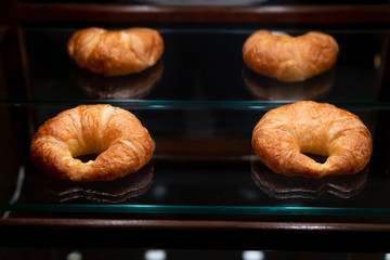 croissant on a serving glass plate