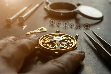 Mechanical watch repair. Watchmaker is repairing the mechanical watches