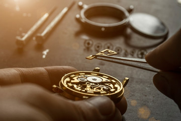 Mechanical watch repair. Watchmaker is repairing the mechanical watches