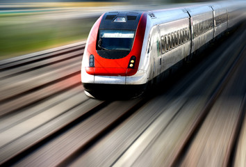 Obraz na płótnie Canvas Train Speeding along its Tracks with Motion Blur. Train Moving Fast, Speed on its Track. Object Focus