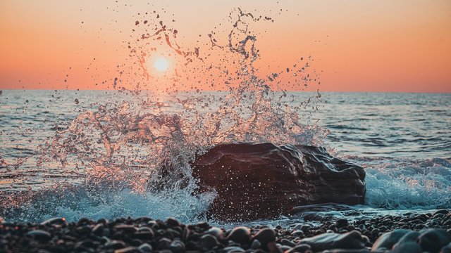 water splashes at sunset