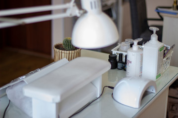 Manicure desktop with lamp and cactus