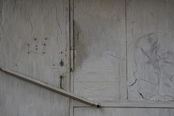old metal wall surface. Painted rusty metal texture of abandoned house wall