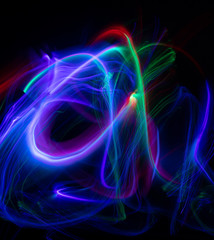 Abstract colored lights curves, frozen light, blue freeze light made with long exposure, black background