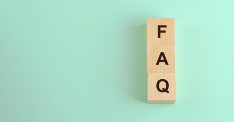 faq frequently asked question vertical text on wooden blocks