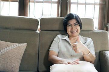 Happy smile asian elderly woman social distance and stay at home.