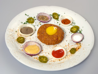 A dish called Tartar Steak. A delicacy prepared from beef.